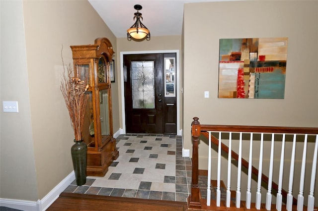 entryway with vaulted ceiling