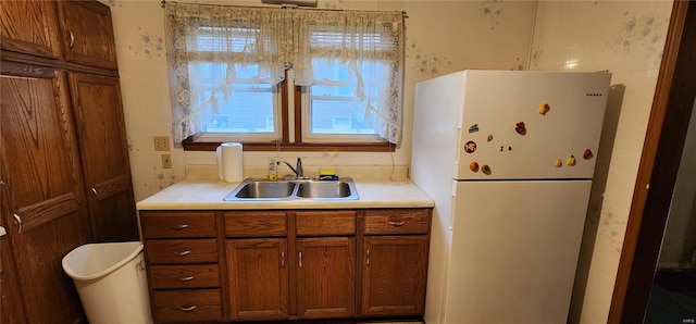 kitchen featuring sink and white refrigerator