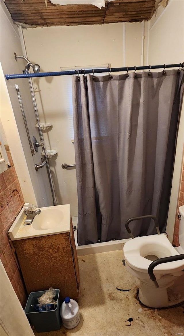 bathroom featuring concrete flooring, sink, toilet, and a shower with curtain