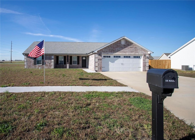 ranch-style house with central AC unit, a garage, and a front lawn