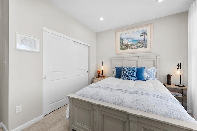 carpeted bedroom with a closet