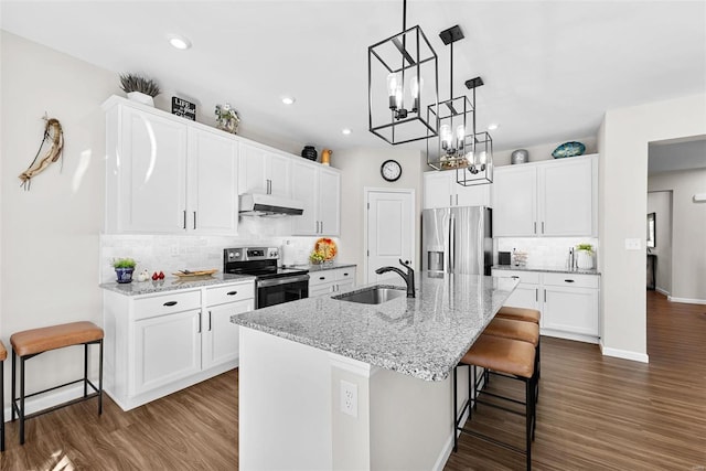 kitchen featuring a kitchen island with sink, stainless steel appliances, white cabinetry, and sink