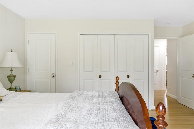 bedroom featuring a closet and light hardwood / wood-style flooring