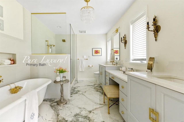 full bathroom featuring vanity, separate shower and tub, toilet, and a chandelier