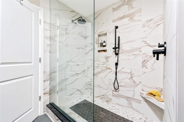 bathroom with tiled shower