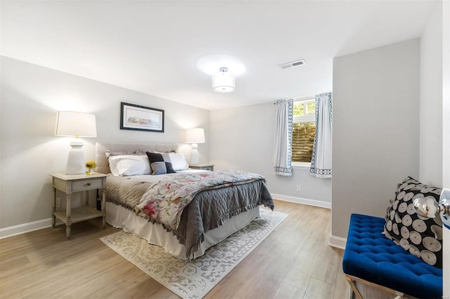 bedroom with wood-type flooring