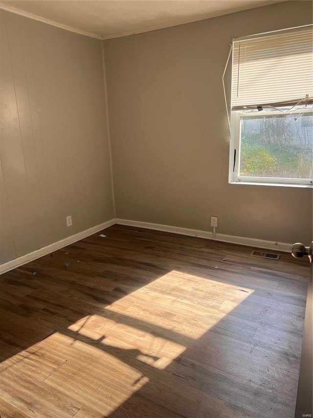 spare room featuring hardwood / wood-style flooring