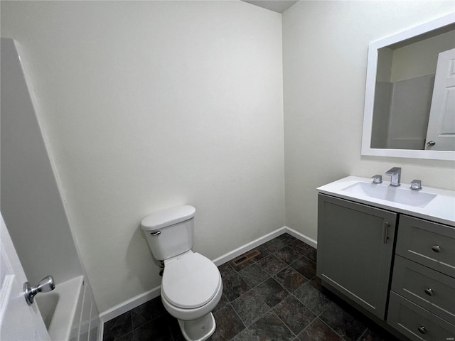 bathroom with vanity and toilet