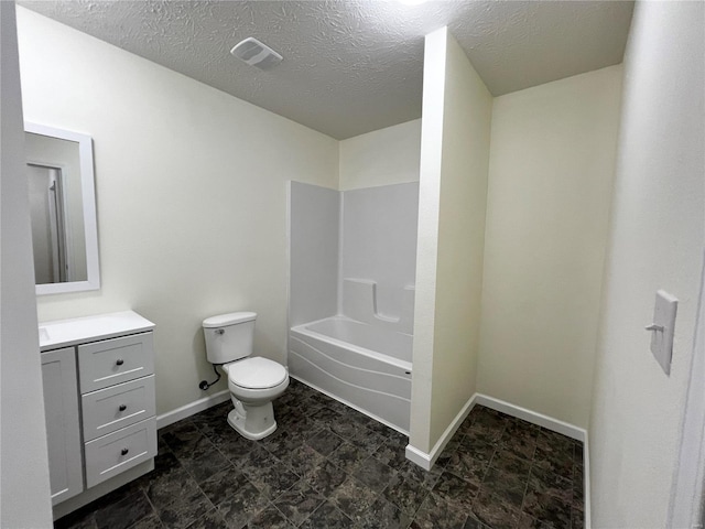 full bathroom featuring vanity,  shower combination, toilet, and a textured ceiling