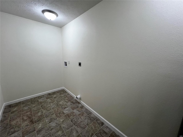 laundry area featuring washer hookup, a textured ceiling, and electric dryer hookup