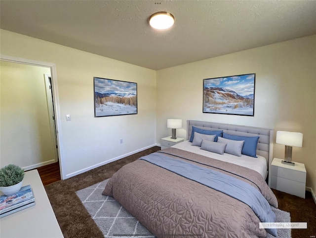 carpeted bedroom featuring a textured ceiling