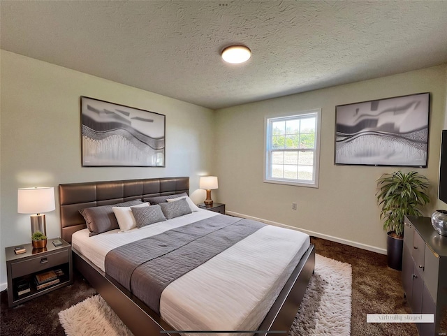 carpeted bedroom with a textured ceiling