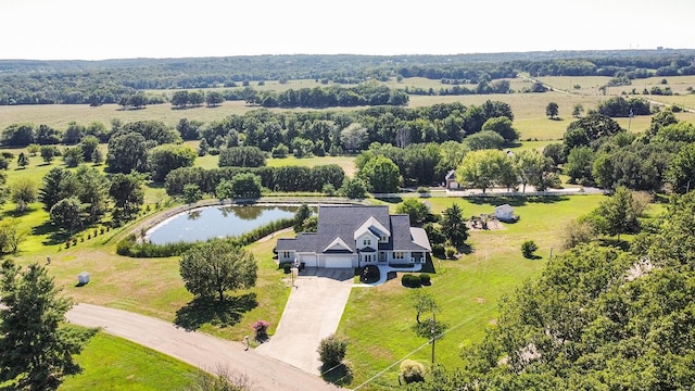 drone / aerial view featuring a rural view and a water view