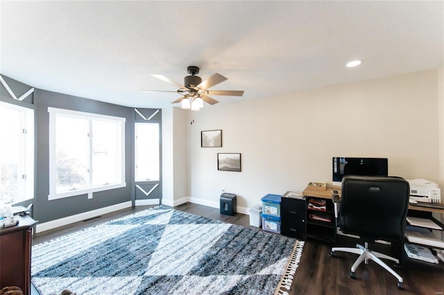 home office with ceiling fan and dark wood-type flooring