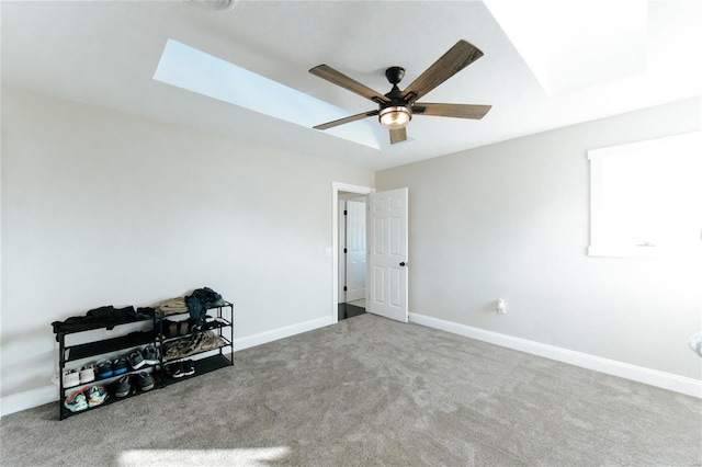 spare room featuring carpet flooring and ceiling fan