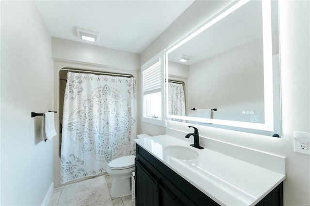 bathroom with tile patterned floors, vanity, and toilet