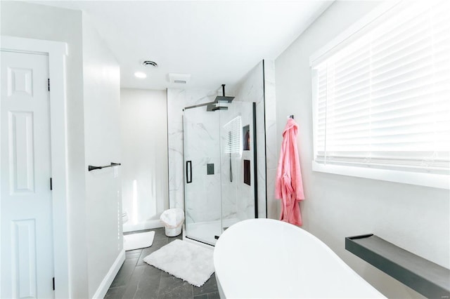 bathroom featuring shower with separate bathtub and tile patterned floors