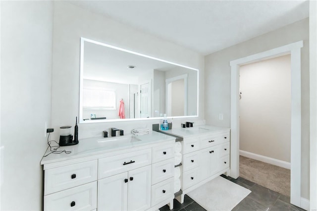 bathroom with tile patterned floors and vanity