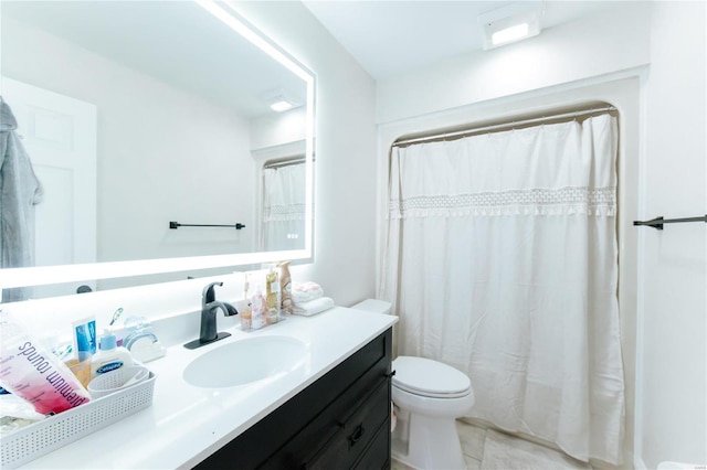 bathroom featuring tile patterned floors, a shower with curtain, vanity, and toilet