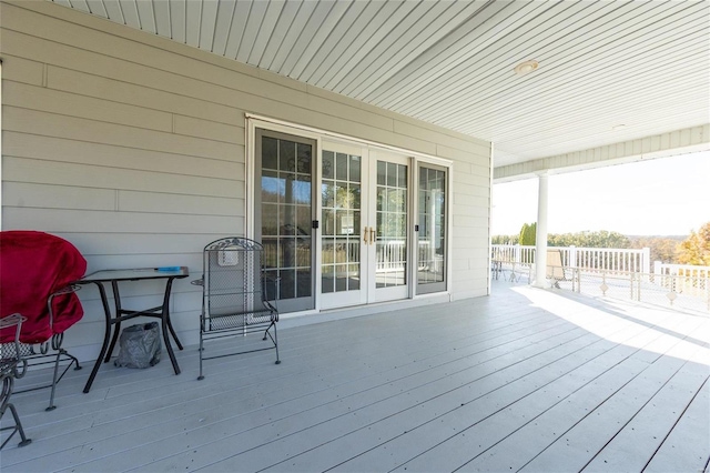 deck featuring covered porch and french doors