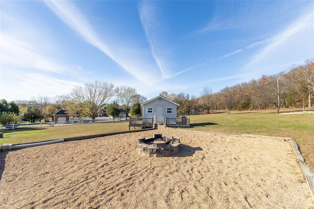 view of yard with an outdoor fire pit