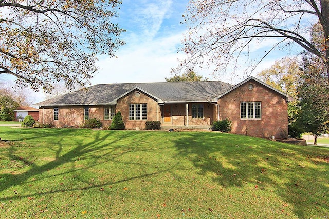 ranch-style home featuring a front yard