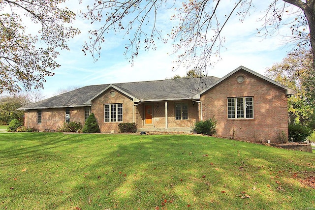 ranch-style house with a front lawn