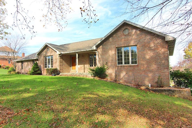 single story home with a front lawn