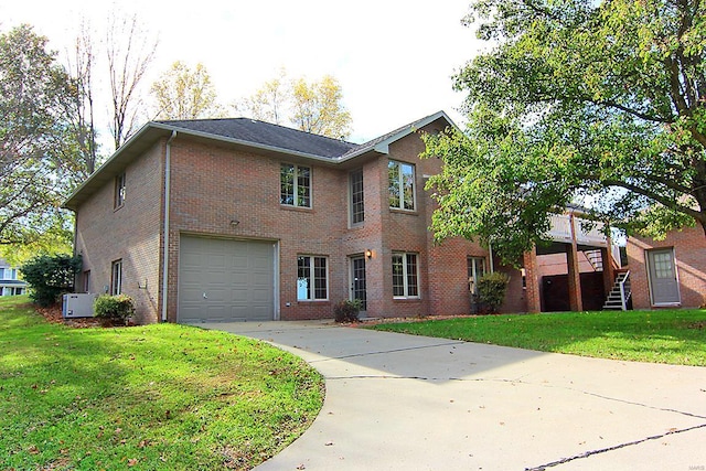 view of front facade with a garage and a front lawn