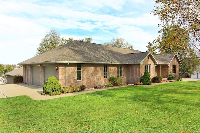 ranch-style home featuring a garage and a front lawn