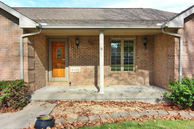 doorway to property with covered porch