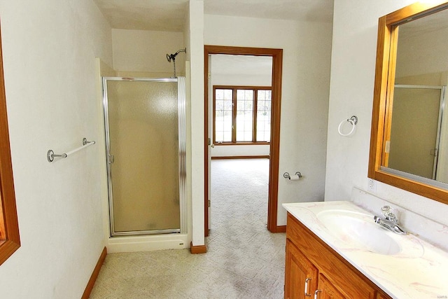 bathroom with vanity and an enclosed shower