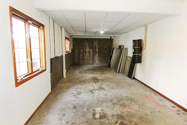 basement featuring a drop ceiling