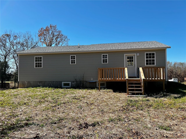 back of property featuring a deck