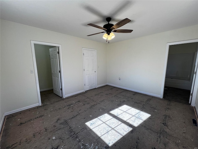 unfurnished bedroom featuring connected bathroom and ceiling fan