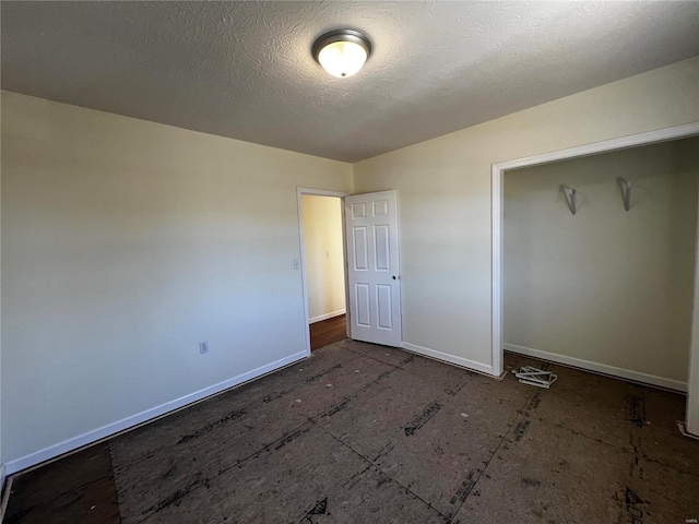 unfurnished bedroom with a textured ceiling