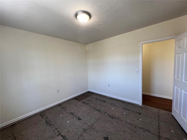 empty room featuring a textured ceiling