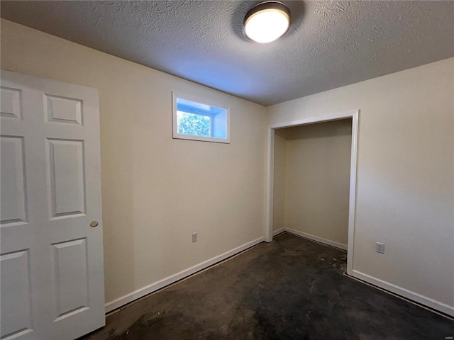 unfurnished bedroom featuring a textured ceiling