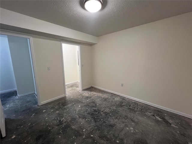 spare room featuring a textured ceiling