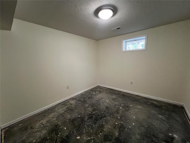 empty room with a textured ceiling