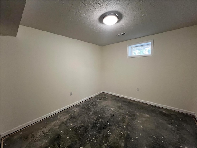 basement with a textured ceiling