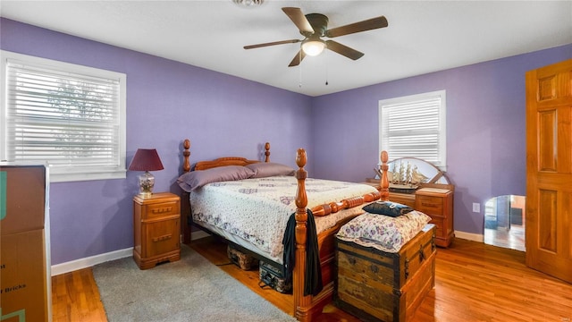 bedroom with hardwood / wood-style floors and ceiling fan