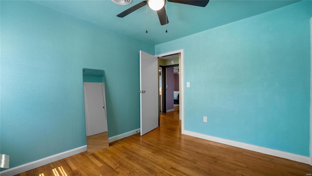 unfurnished bedroom with hardwood / wood-style flooring and ceiling fan