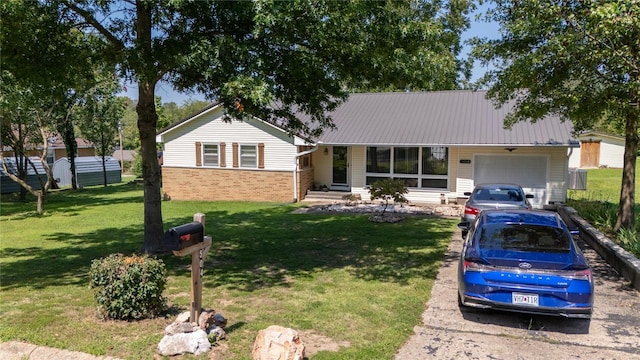 single story home with a front yard and a garage