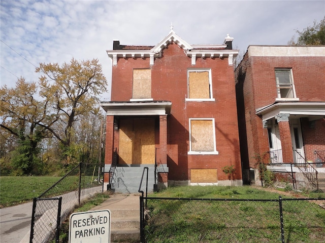 view of front of property with a front lawn and a porch