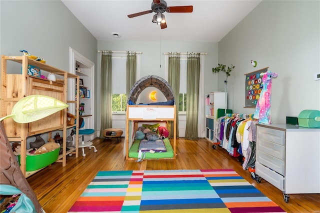 bedroom with hardwood / wood-style flooring and ceiling fan