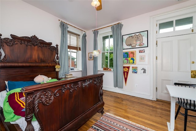 bedroom featuring hardwood / wood-style flooring and ceiling fan