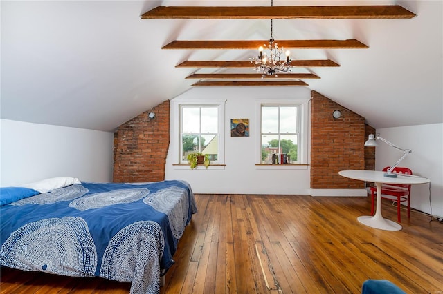 bedroom featuring lofted ceiling with beams, hardwood / wood-style floors, brick wall, and a notable chandelier