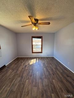 unfurnished room with ceiling fan, dark hardwood / wood-style floors, and a textured ceiling