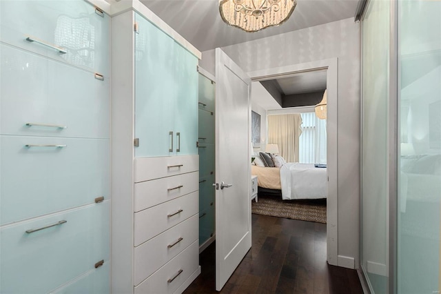 corridor featuring dark hardwood / wood-style floors